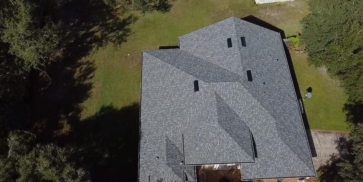 Drone angle over the Eustis roof from another side, with box vents and a satellite dish