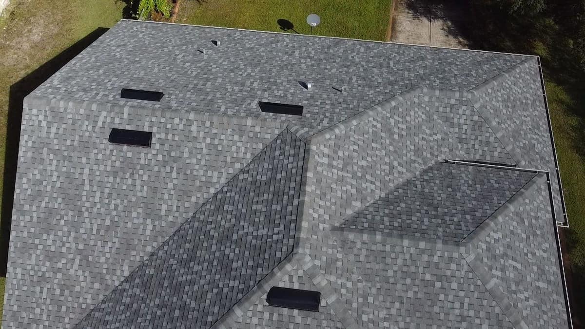 Close drone view of box vents, pipe vents and capped hips on the Eustis roof
