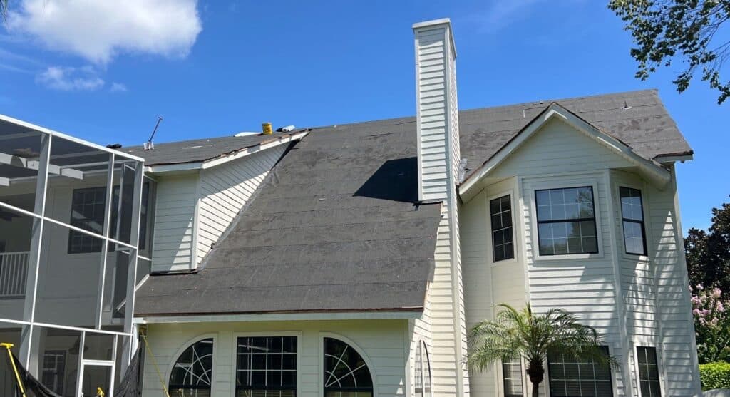 Home in Windermere, FL with peel-and-stick underlayment being installed during a roof replacement